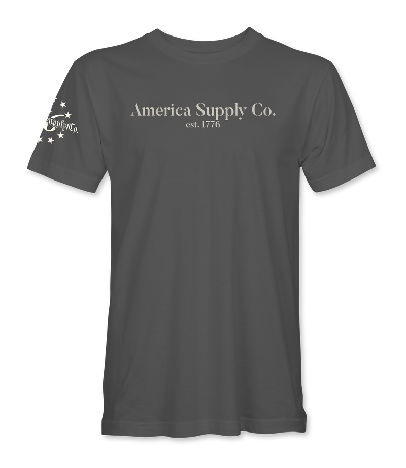 The Alex Jones Store - Front view of gray America Supply Co. 'Est. 1776' t-shirt with center chest text and stars sleeve detail