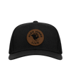 The Alex Jones Store - Black trucker hat with brown leather circle patch featuring 'Alex Jones Live' globe logo, front view