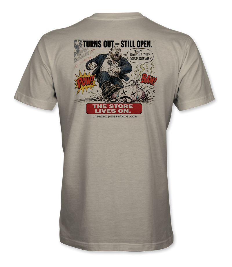 The Alex Jones Store - Back of cream Turns Out Still Open tee with Alex Jones stomping NPC onion comic art and 'The Store Lives On' banner