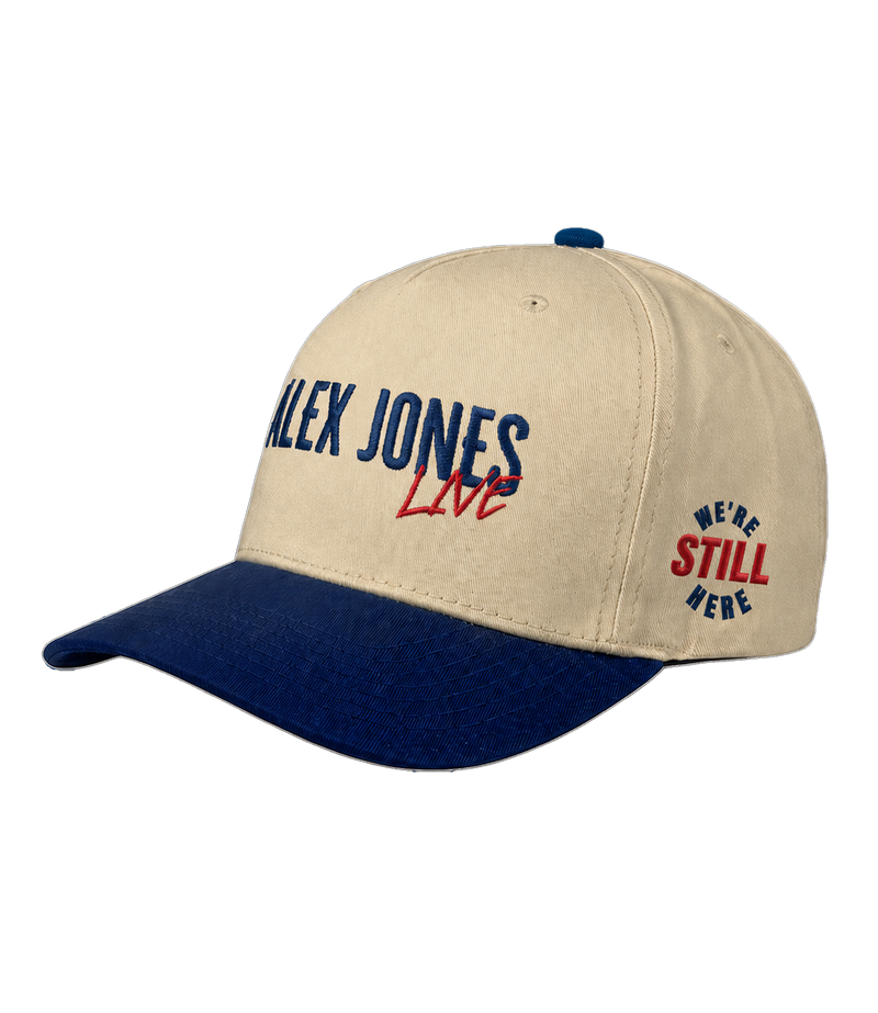 The Alex Jones Store - Side view of tan and navy Alex Jones Live Tan Embroidered Hat with 'ALEX JONES Live' front logo and 'We're Still Here' side stamp