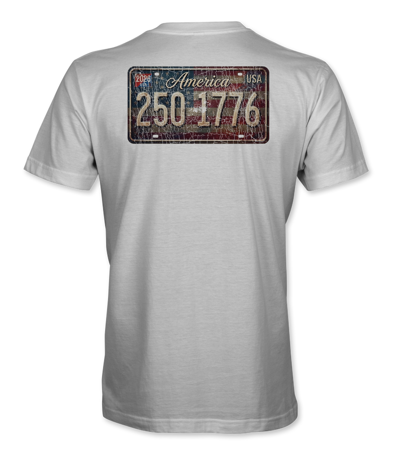 The Alex Jones Store - Back of white 'America 250 1775' tee with distressed vintage license plate graphic over American flag background