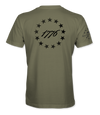 The Alex Jones Store - Back of olive green 1776 America Supply Co t-shirt with black 13-star Betsy Ross ring around 1776 numerals