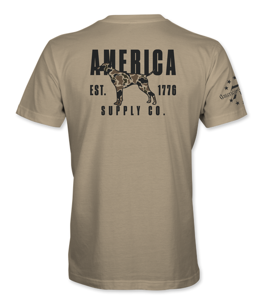 The Alex Jones Store - Back of tan America Supply Co Hunting Dog t-shirt with black camo-filled pointer dog and Est. 1776 banner print