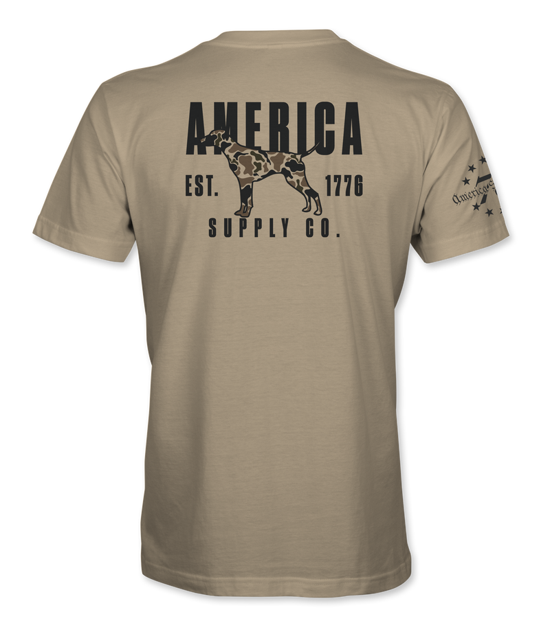 The Alex Jones Store - Back of tan America Supply Co Hunting Dog t-shirt with black camo-filled pointer dog and Est. 1776 banner print
