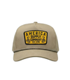The Alex Jones Store - Front view of tan rope-brim cap with yellow America Supply Company Est. 1776 patch featuring twin rattlesnake design