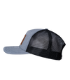 The Alex Jones Store - Heather grey and black trucker hat, left side view, with American flag leather patch on front, Betsy Ross flag style