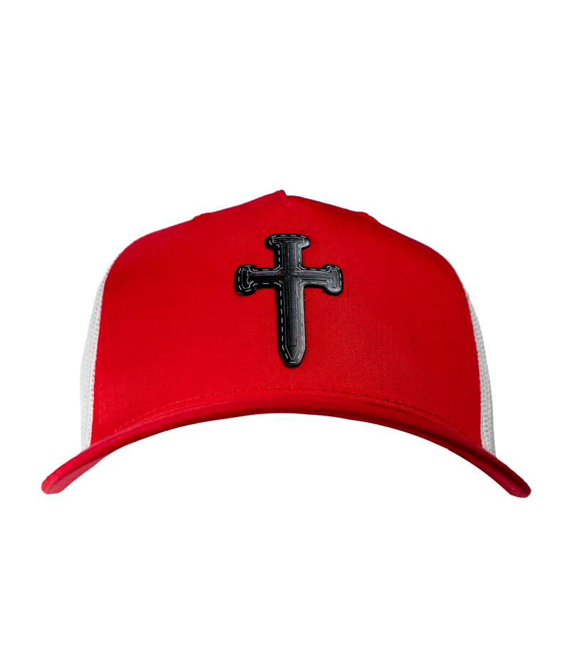 The Alex Jones Store - Front view of red and white Deus Vult Cross Nails trucker hat with black leatherette cross-of-nails patch on crown