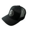 The Alex Jones Store - Three-quarter view of black trucker hat with Obedience To God circle star leather patch and mesh back