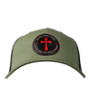 The Alex Jones Store - Front of olive green trucker hat with circular patch showing red cross and 'In Hoc Signo Vinces - In This Sign You Shall Conquer'