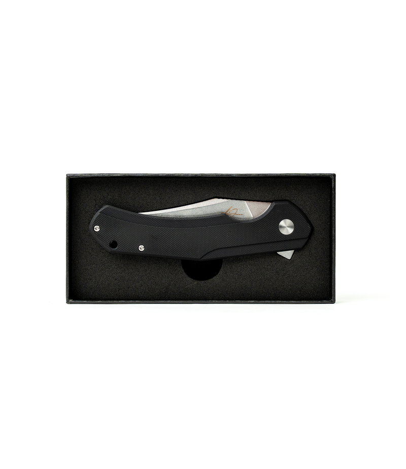 The Alex Jones Store - Alex Jones Phantom folding blade displayed inside premium black foam-lined gift box, closed position with black G10 handle