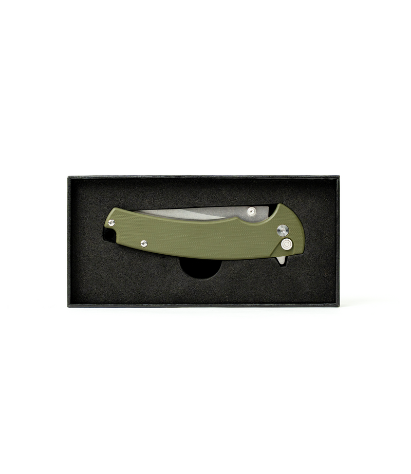 The Alex Jones Store - Alex Jones Quick Release folding blade in OD green displayed inside black foam-lined gift box, retail-ready packaging