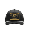 The Alex Jones Store - Front of black American Patriot Shooting Club hat with gold-bordered stitched patch, white rope and black mesh back
