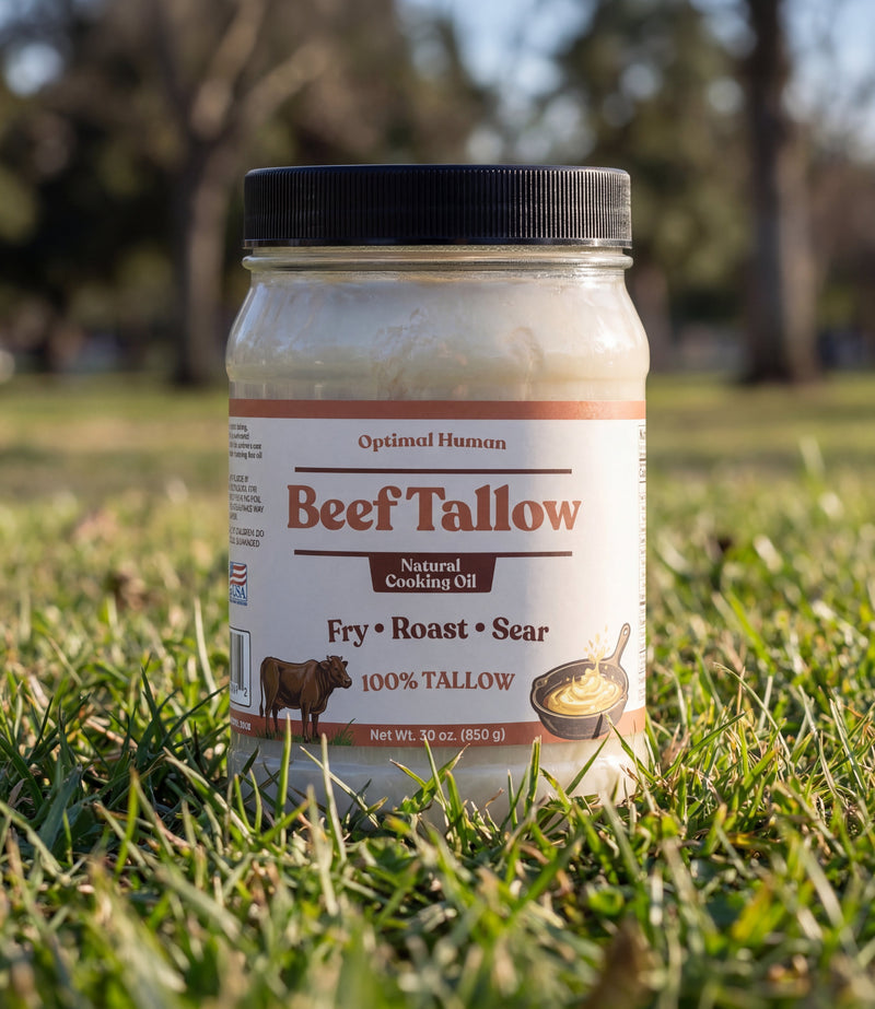 Alex Jones Naturals - Jar of Optimal Human grass-fed Beef Tallow on green grass in sunny park, natural cooking oil lifestyle shot