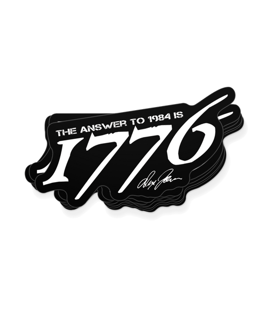 The Alex Jones Store - Black die-cut vinyl decal reading 'The Answer To 1984 Is 1776' in white grunge type with Alex Jones signature